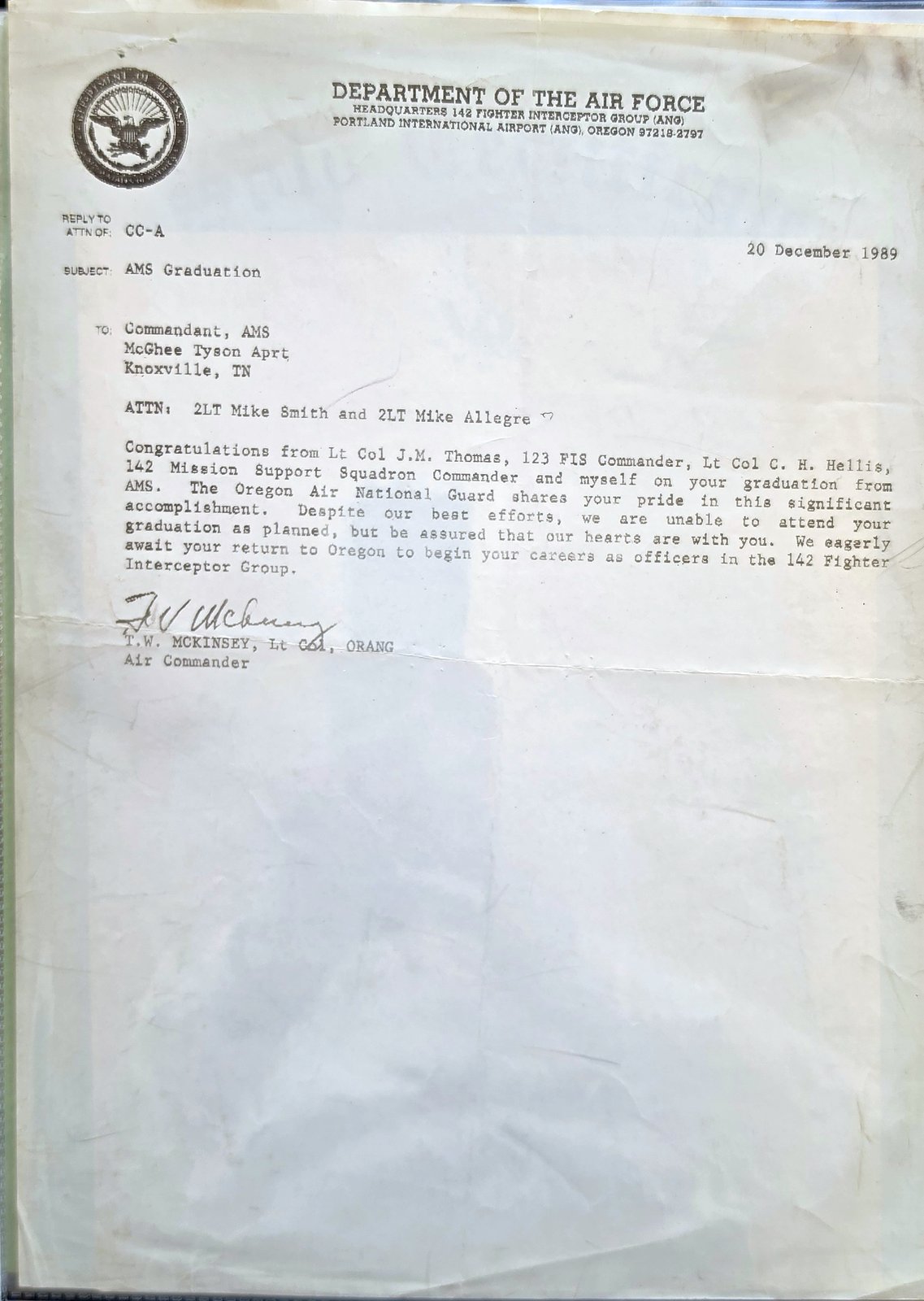Typed letter on Department of the Air Force letterhead from Headquarters 142 Fighter Interceptor Group (ANG), Portland International Airport, dated 20 December 1989, subject AMS Graduation, addressed to 2LT Mike Smith and 2LT Mike Allegre, signed by the Air Commander