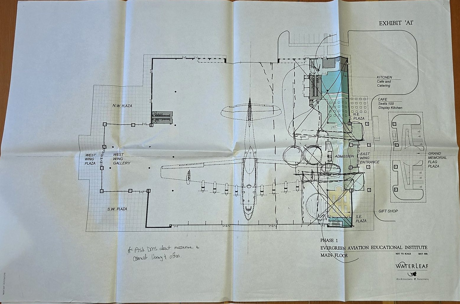 Folded plan sheet marked Exhibit A1: Phase 1, Evergreen Aviation Educational Institute, Main Floor, by Waterleaf, with the Spruce Goose drawn at the center of the hall