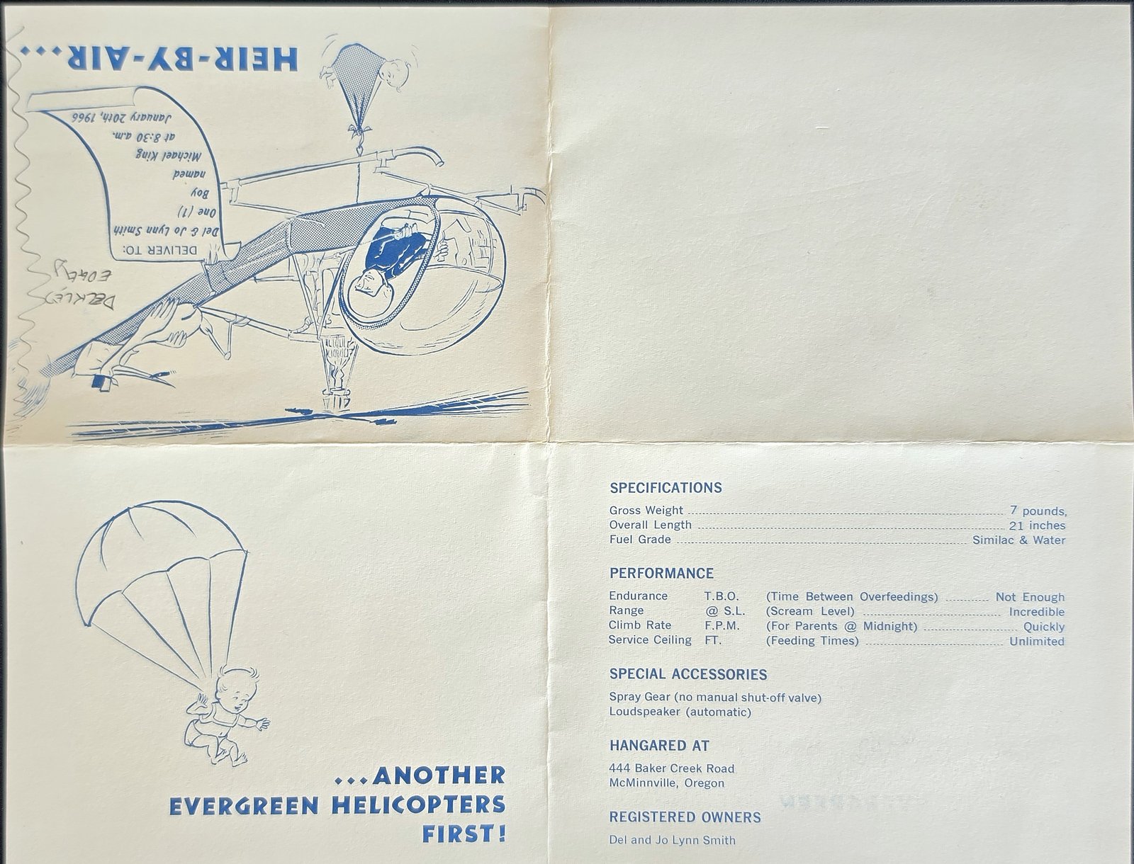 Birth announcement opened flat: a cartoon of a helicopter carrying a baby under the heading Heir-by-Air, with a delivery tag, printed upside down on the cover panel; below it a parachuting baby beside the words Another Evergreen Helicopters First! and a list of specifications