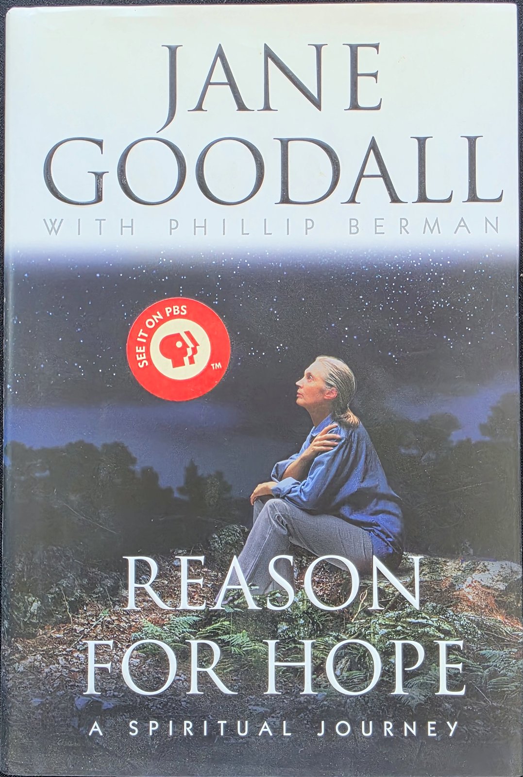 Cover of Reason for Hope: A Spiritual Journey by Jane Goodall with Phillip Berman, showing Goodall seated outdoors, with a round See it on PBS sticker